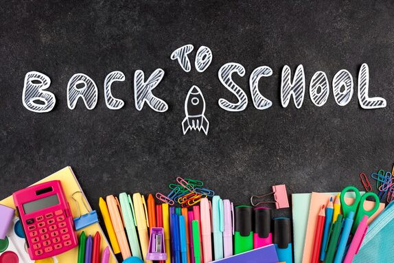 back-school-background-with-school-supplies-chalkboard.jpg